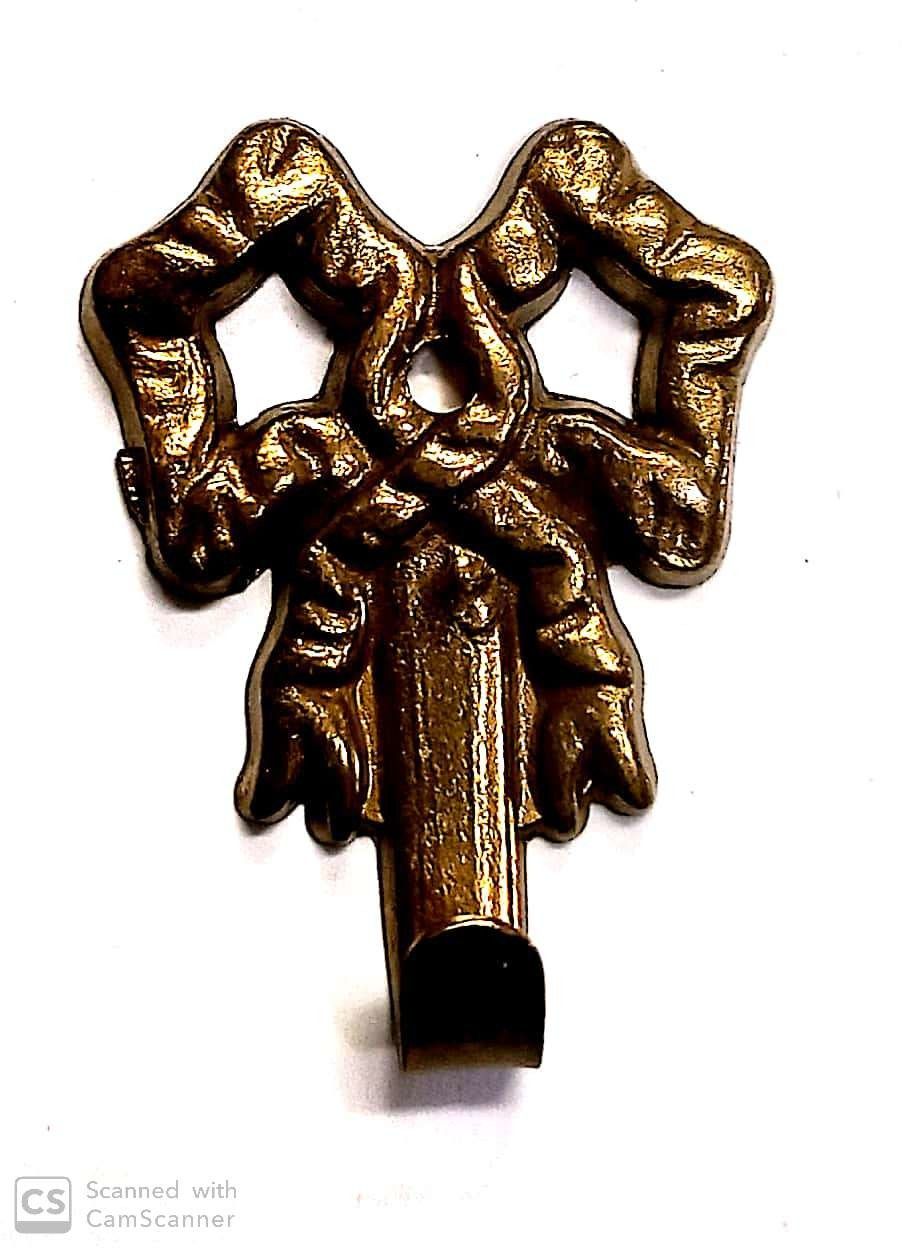 Attaccaglia mod. FIOCCO in ottone lucido