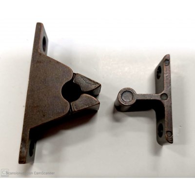 Pinzetta bloccaporta in zama bronzato